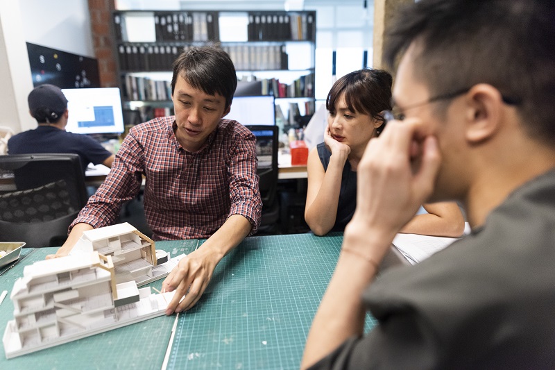 Architect Joseph Lee at his office in discussion